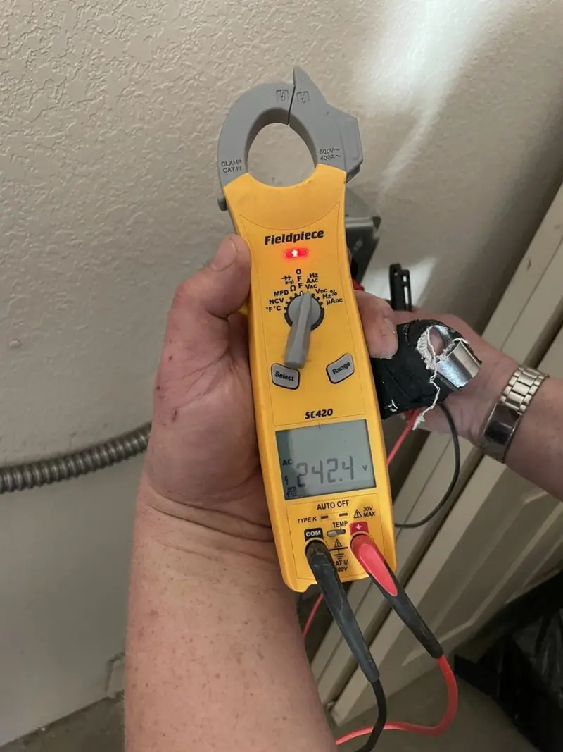 Voltage testing with clamp meter during Electrical Installation Services in Walbridge